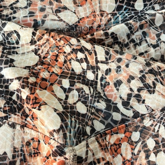 Evolution and Creation orange/cream/black patterned athletic pants. Size Large. - Picture 4 of 6